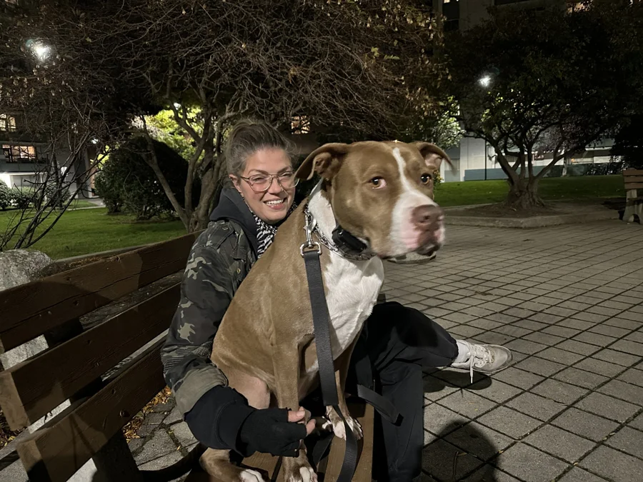 Tony sitting with a woman on a park bench