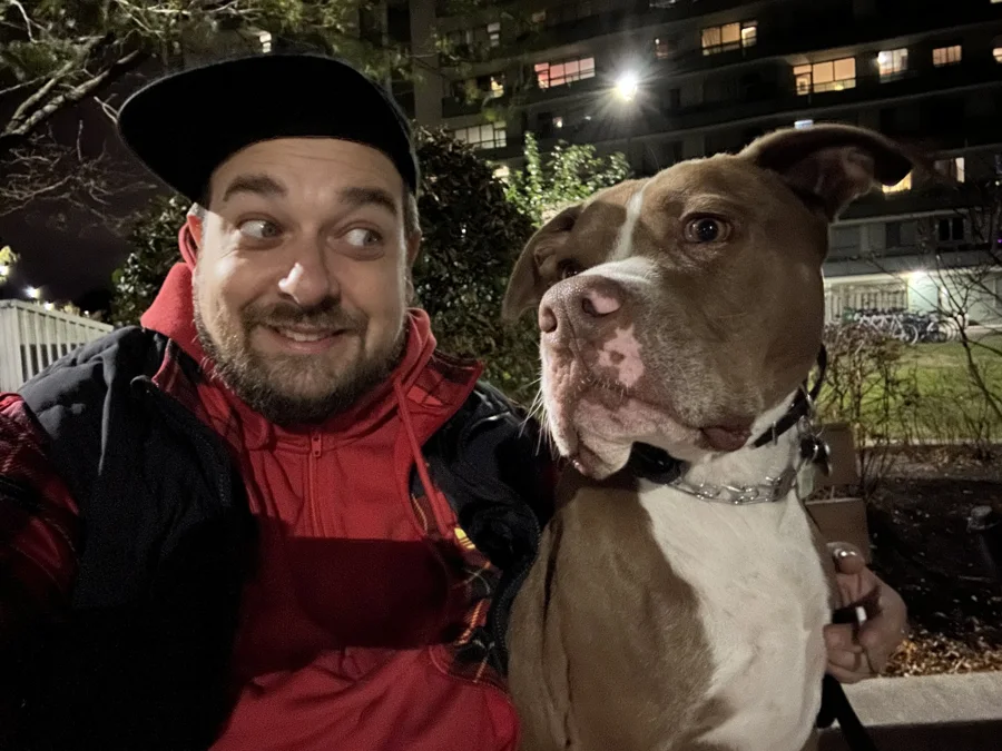 Tony beside a smiling man outdoors